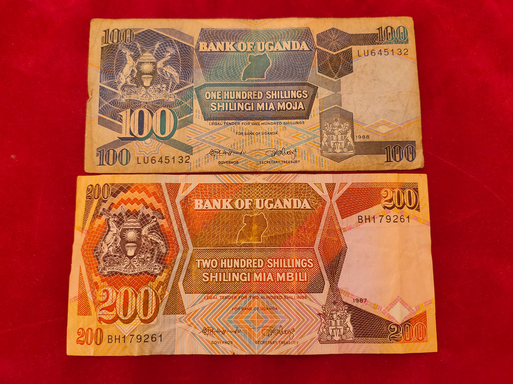 BANK OF UGANDA 100, 200 SHILLINGS (C764)