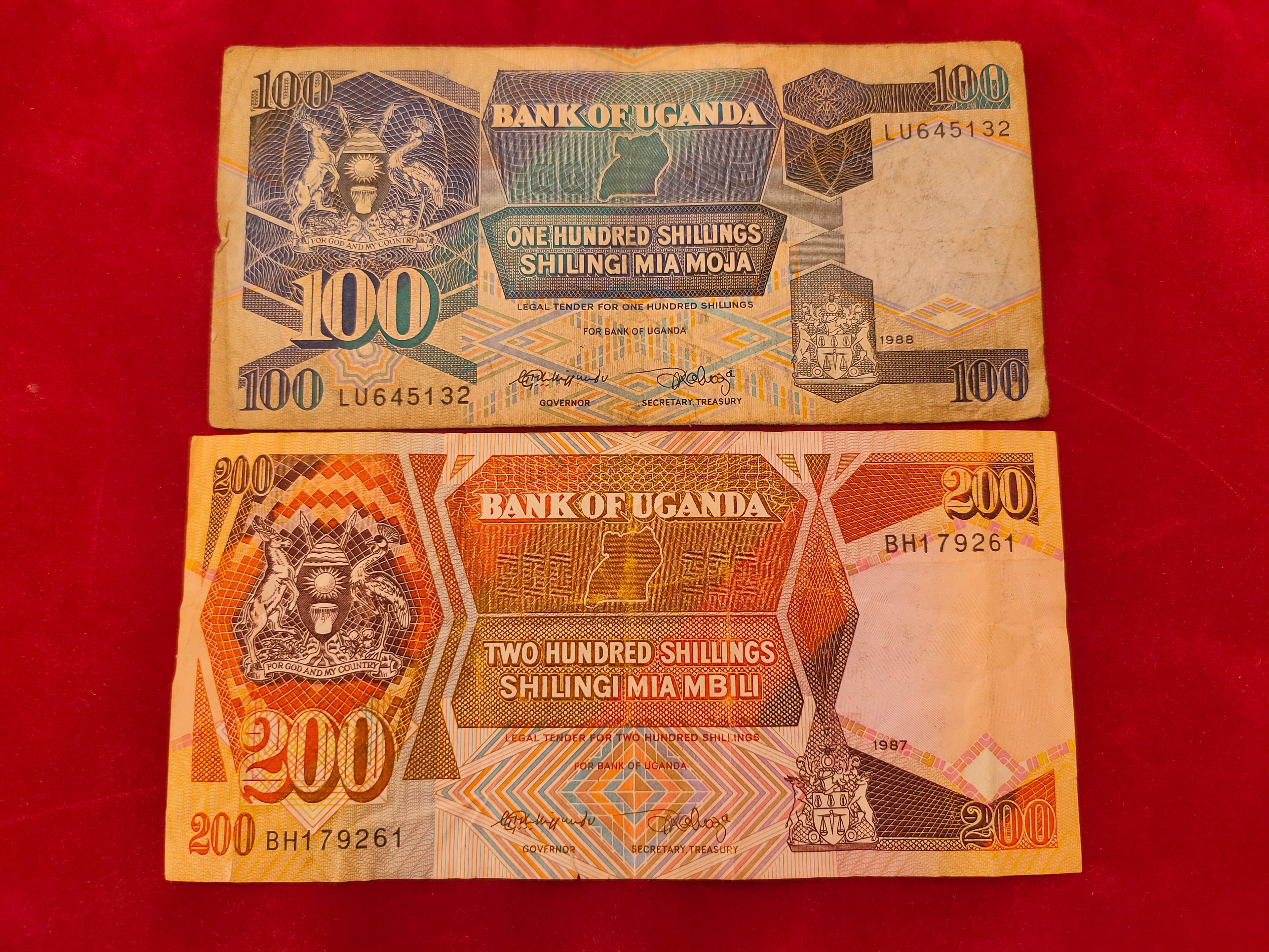 BANK OF UGANDA 100, 200 SHILLINGS (C764)
