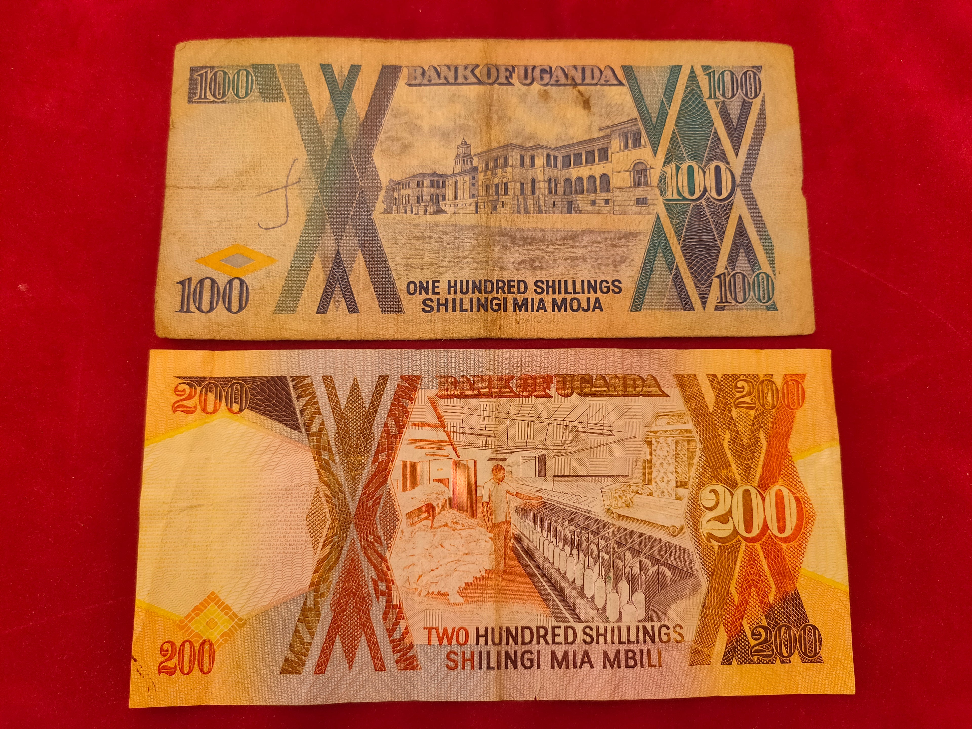BANK OF UGANDA 100, 200 SHILLINGS (C764)