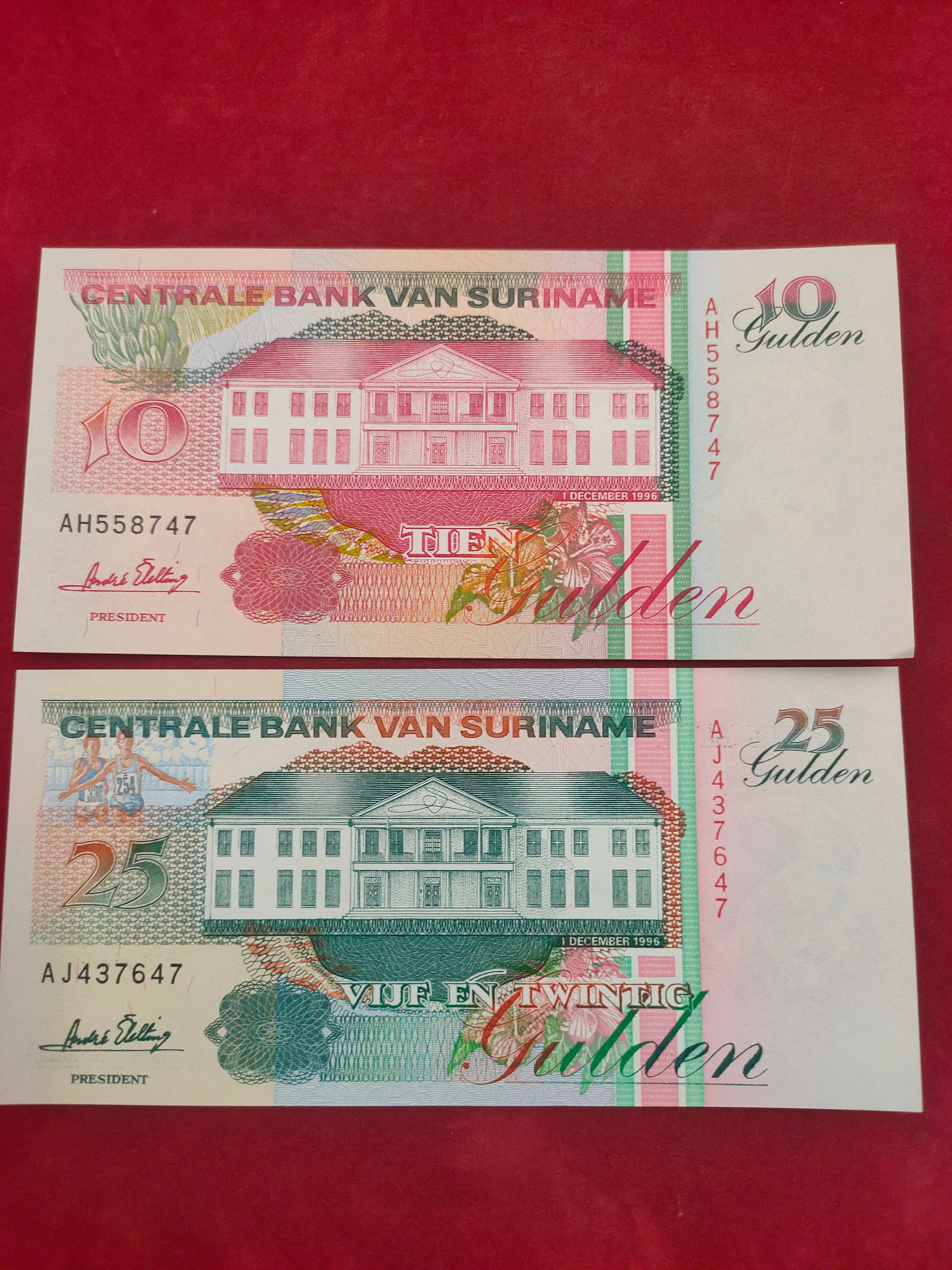 CENTRAL BANK OF SURINAME 10, 25 GULDEN (C409)